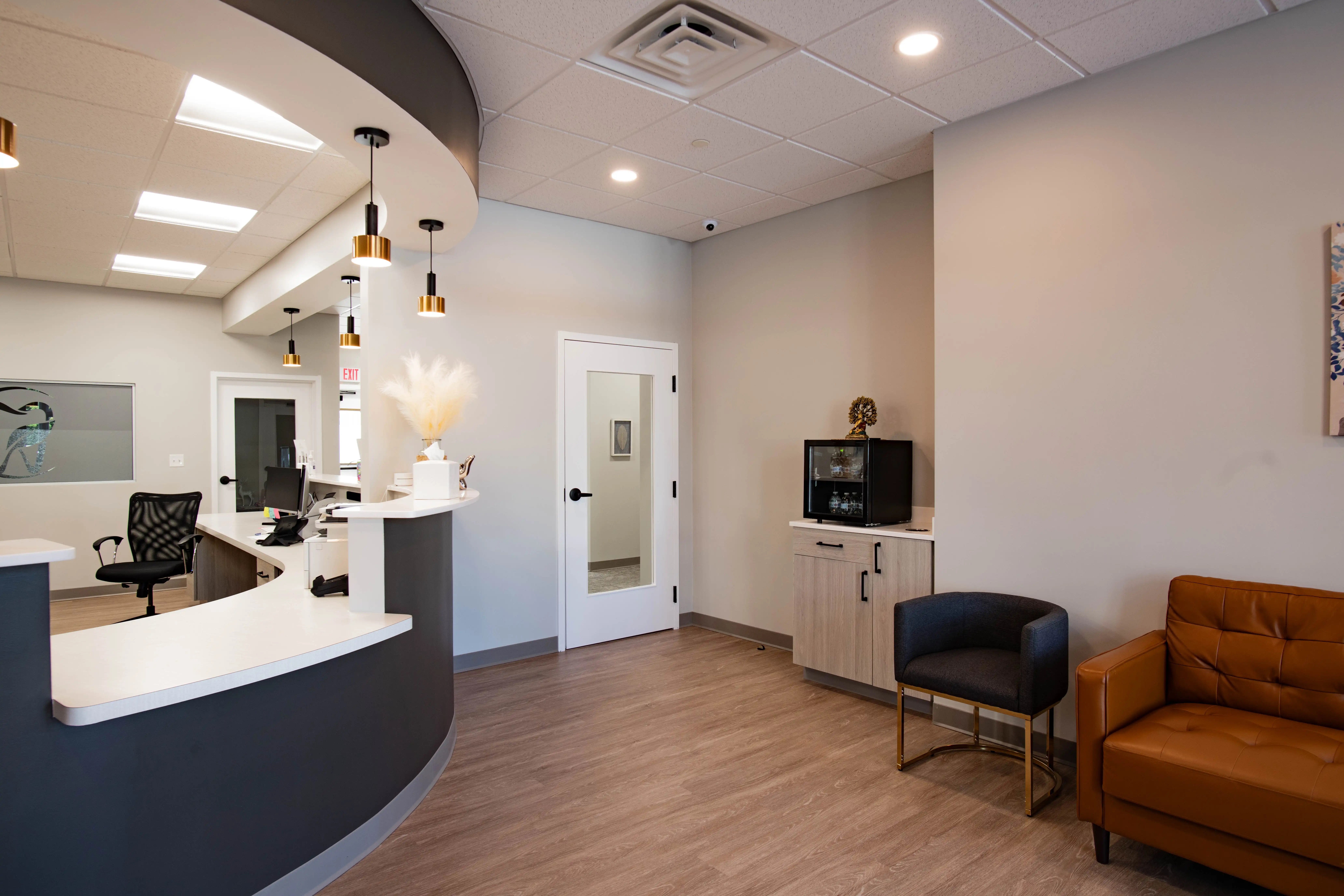 waiting room, front desk, and door to exam room